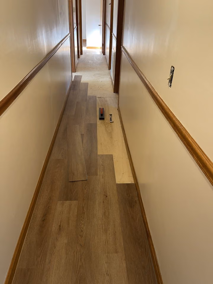 Hallway LVP flooring installation in progress.