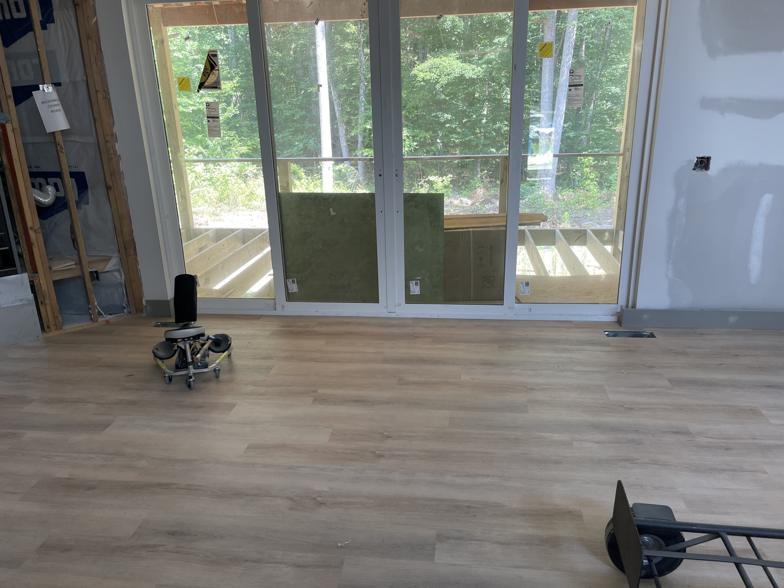 2023 07 03 Greensboro NC 2800SF LVP Installation patio entrance after 1